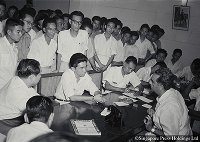 Chief Minister David Marshall meeting 40 busmen regarding the arrest of their leader, Fong Swee Suan, Secretary of the Singapore Bus Workers' Union, 1955.