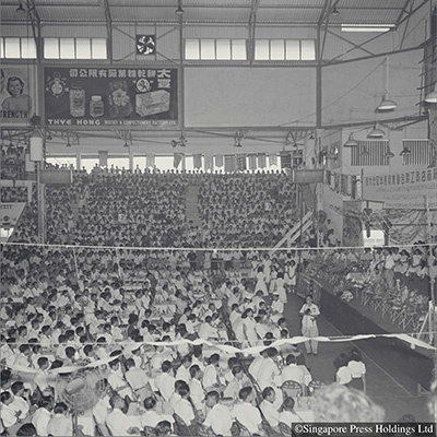Members of the Singapore Factory and Shop Workers' Union celebrating the union's first anniversary, Singapore Badminton Hall, 1955.