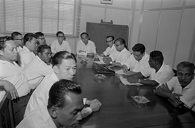 Central Committee of NTUC calling on then Acting Minister for Labour, Ong Pang Boon, to press for the early creation of a centralised Labour Research Unit, 1962. Seated next to Ong, at the head of the table was Finance Minister Goh Keng Swee.